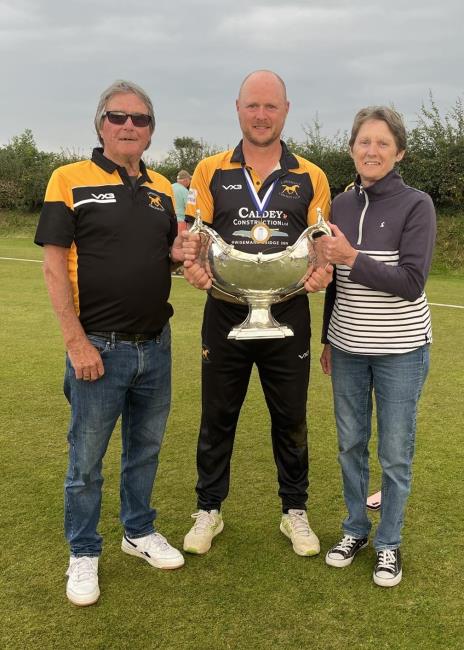 Rob Williams holds The Bowl alongside parents Chris and Rhona